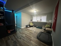 a living room with a couch and a chair