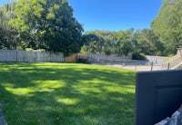a backyard with a fence and a pool
